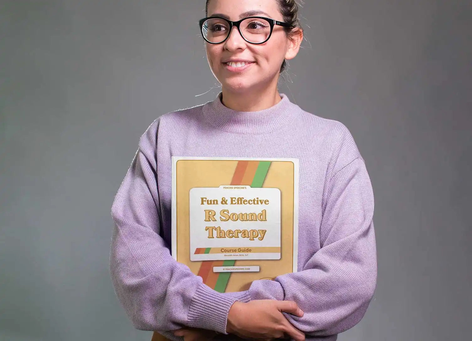 A book titled ’Fun & Effective E-Speech Therapy’ with a retro-style yellow cover.