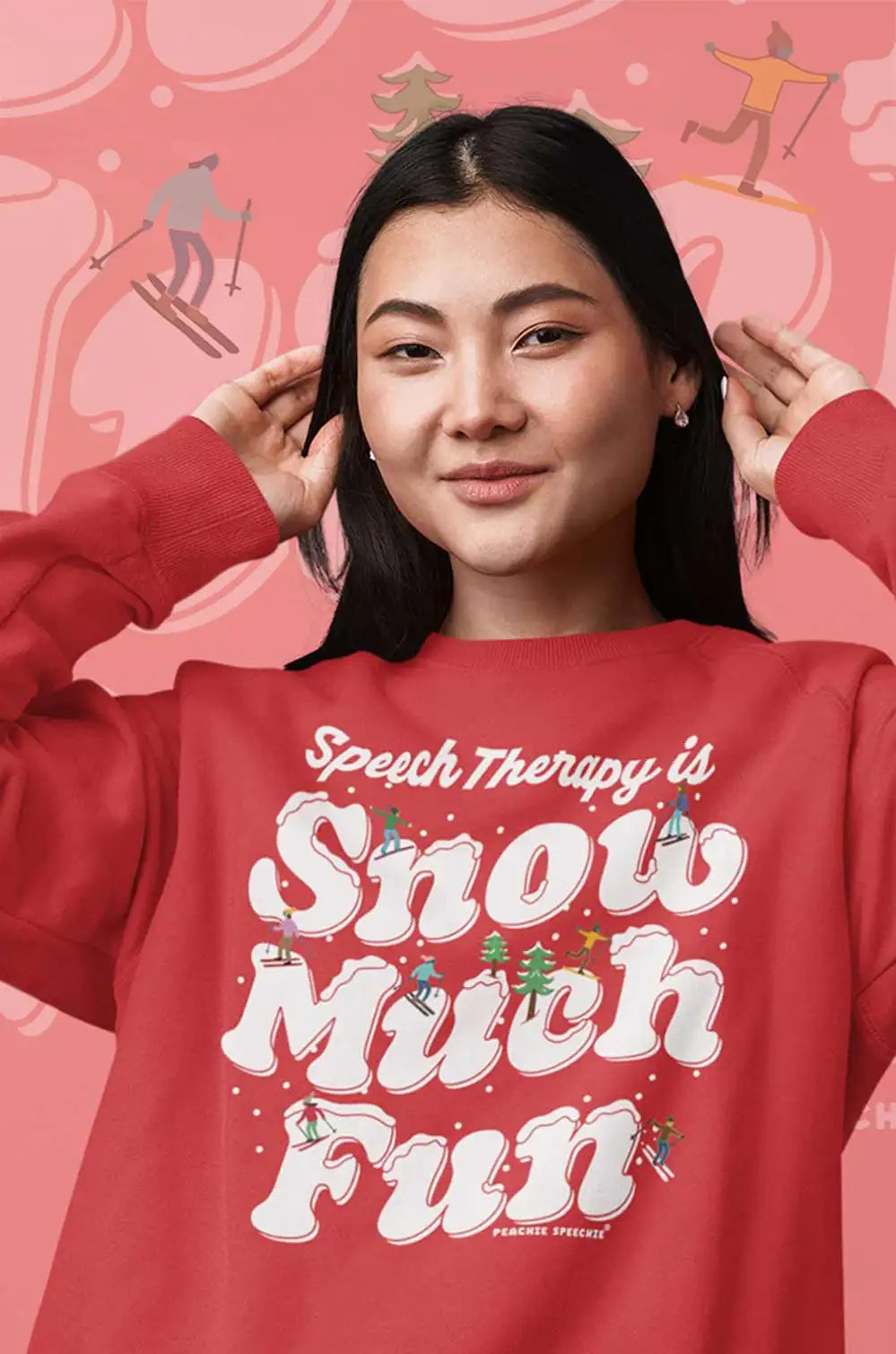 Red sweatshirt with ’speech therapy is snow much fun’ design and holiday ornaments.
