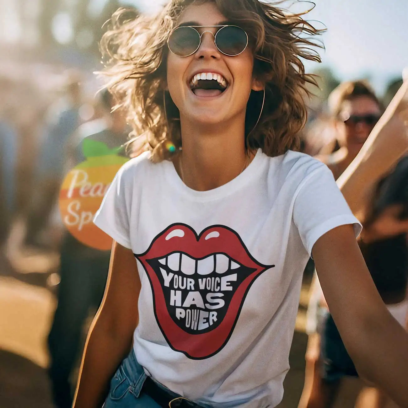 White cotton t-shirt featuring a bold red lips graphic with the text ’your voice has power’ in black and white lettering.