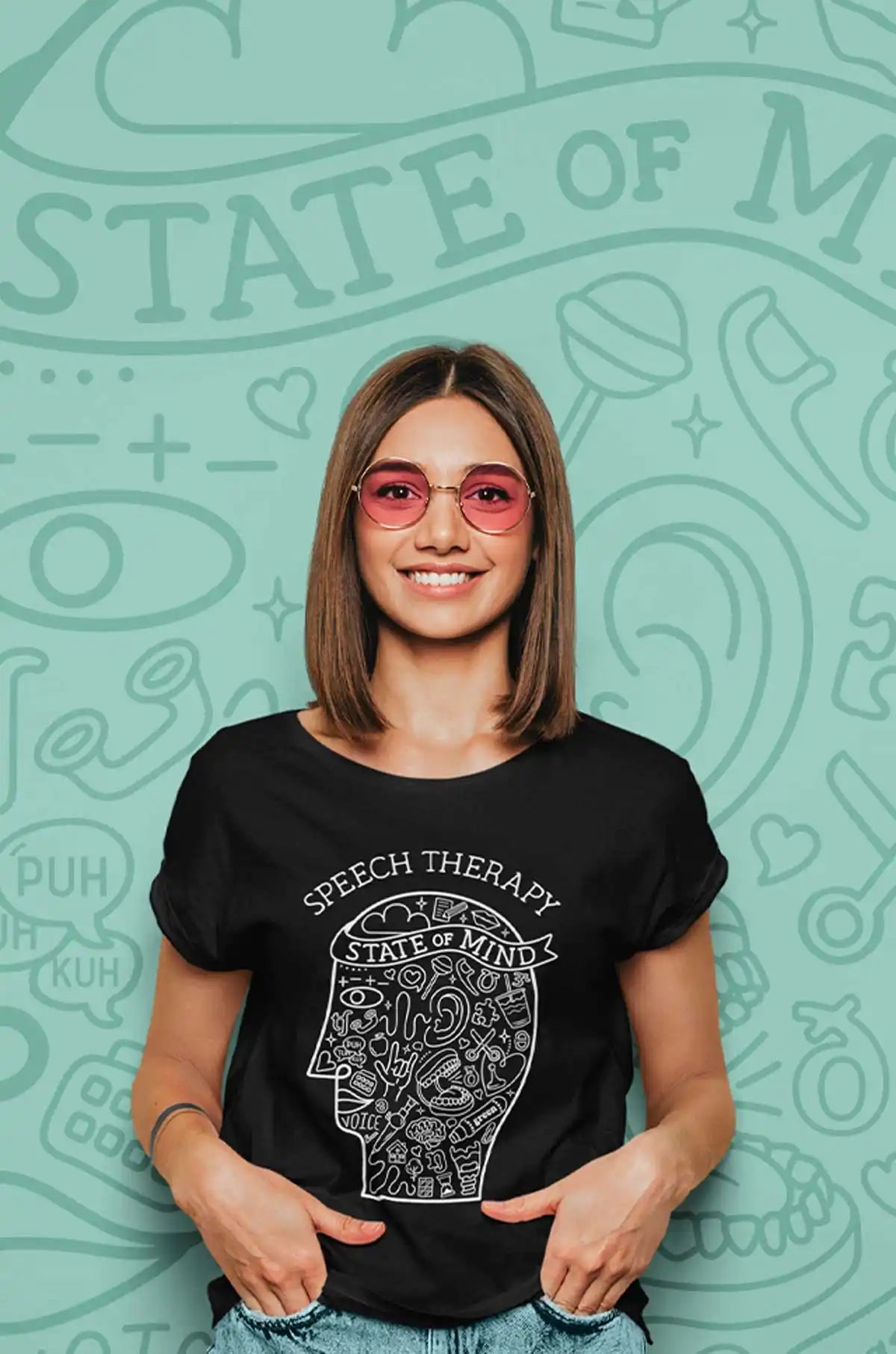 A black t-shirt featuring a line-art head design filled with speech therapy-related terms and symbols.