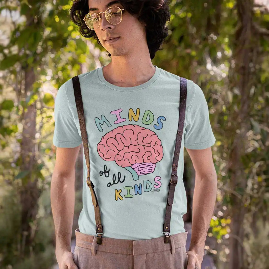 A light blue short-sleeved t-shirt with a colorful brain graphic and the text ’MINDS of all KINDS’.