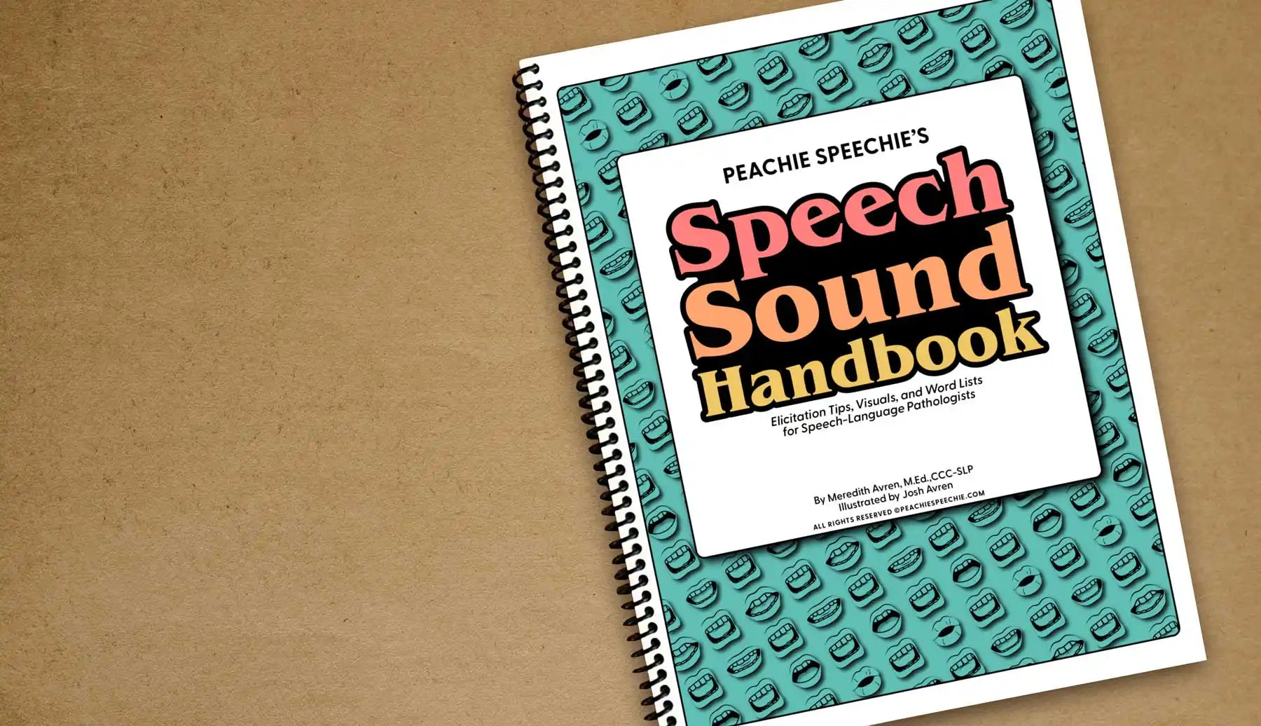 Spiral-bound ’Speech Sound Handbook’ with a teal patterned cover.