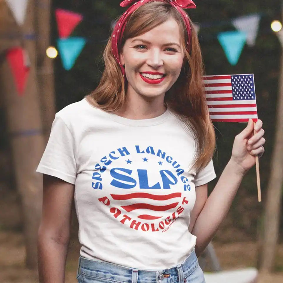 White t-shirt with ’Speech Language Pathology’ and American flag design printed on it.