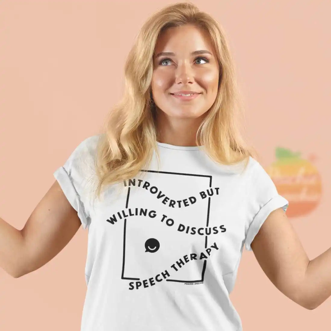 White t-shirt with text reading ’Introverted but willing to discuss speech therapy’ in a square design.